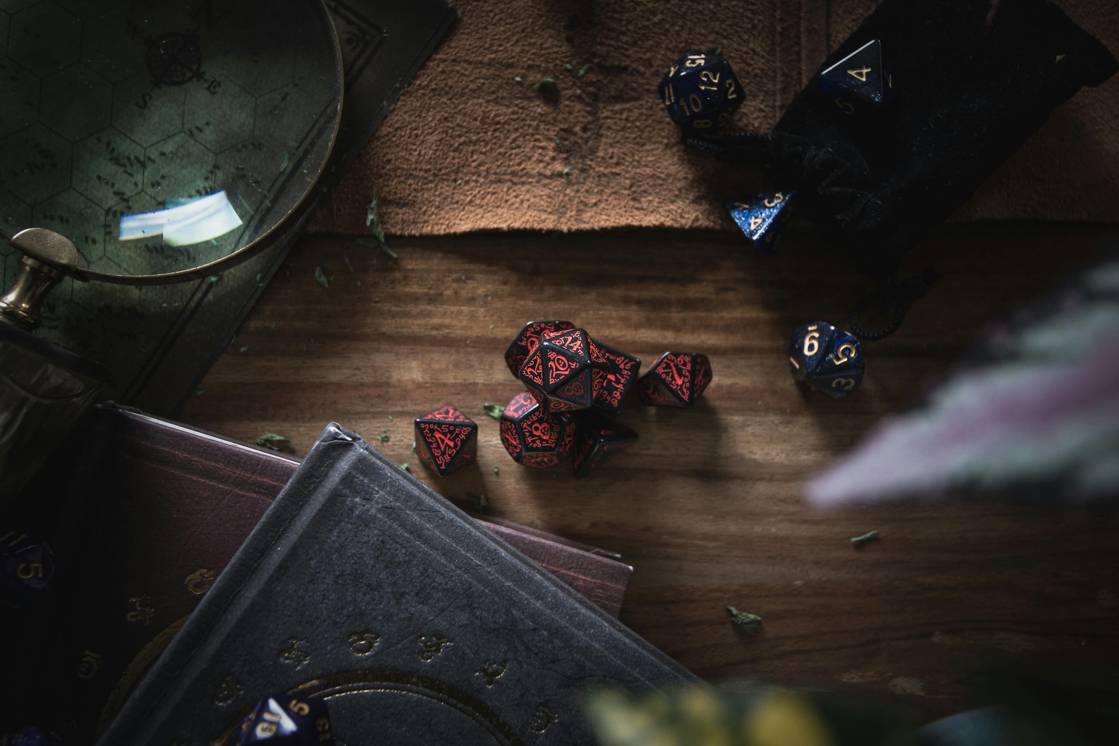 Polyhedral dice arranged on a wooden tabletop.